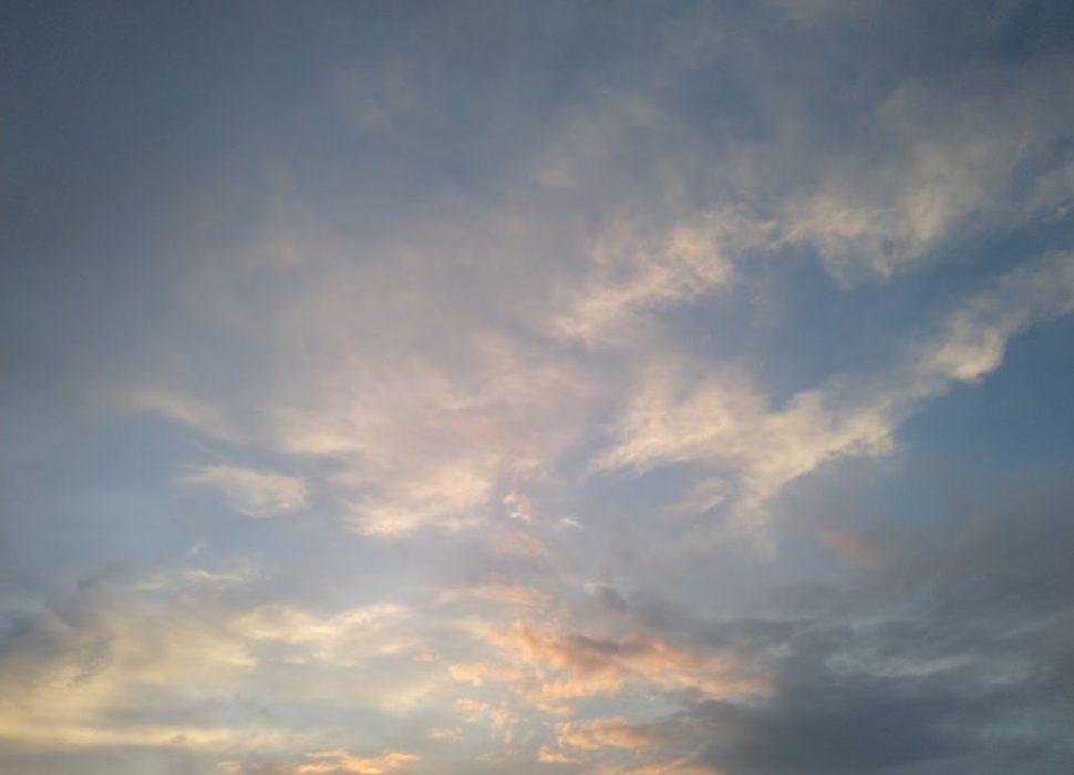 Pictures of blue sky with puffy pink and yellow clouds