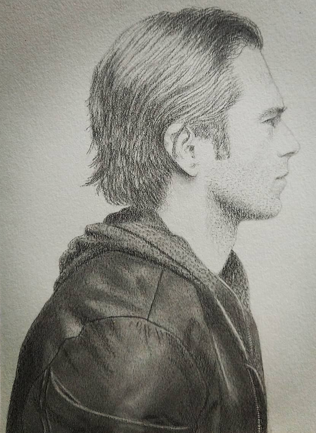 pencil sketch of the profile of a man in a dark jacket