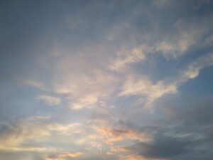 Pictures of blue sky with puffy pink and yellow clouds